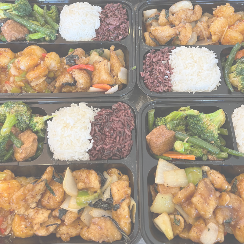 An array of bento boxes, each filled with fish, assorted veggies, and rice.